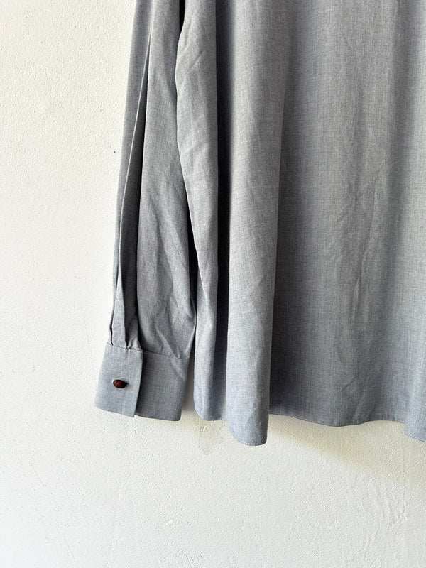 Blue longsleeve blouse.