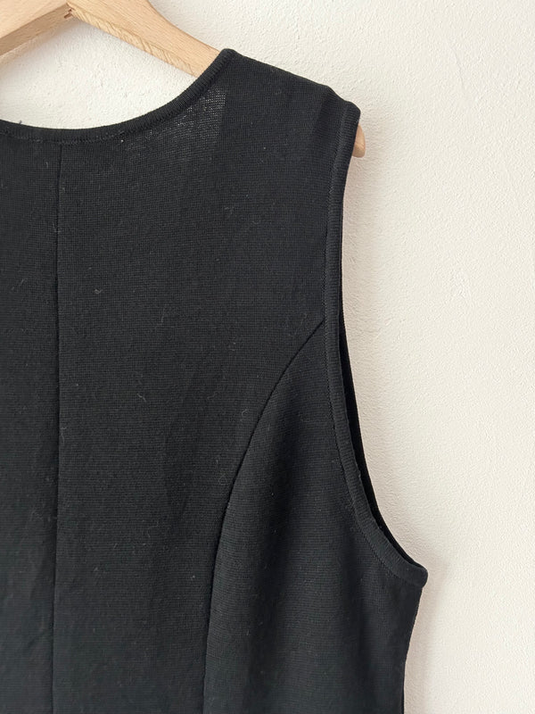 Black fringe knit vest.