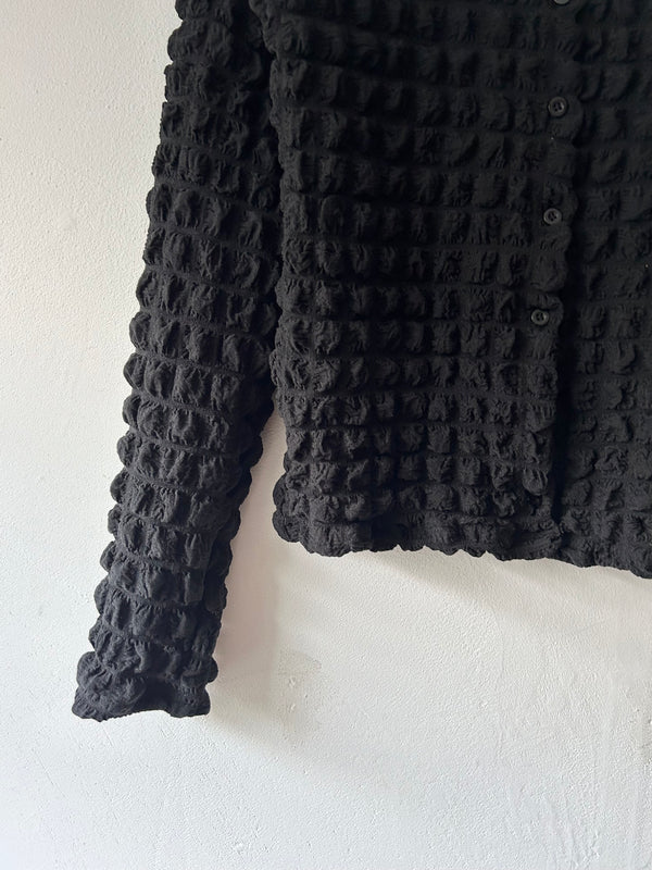 Black pon-pon blouse.