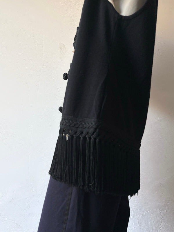 Black fringe knit vest.