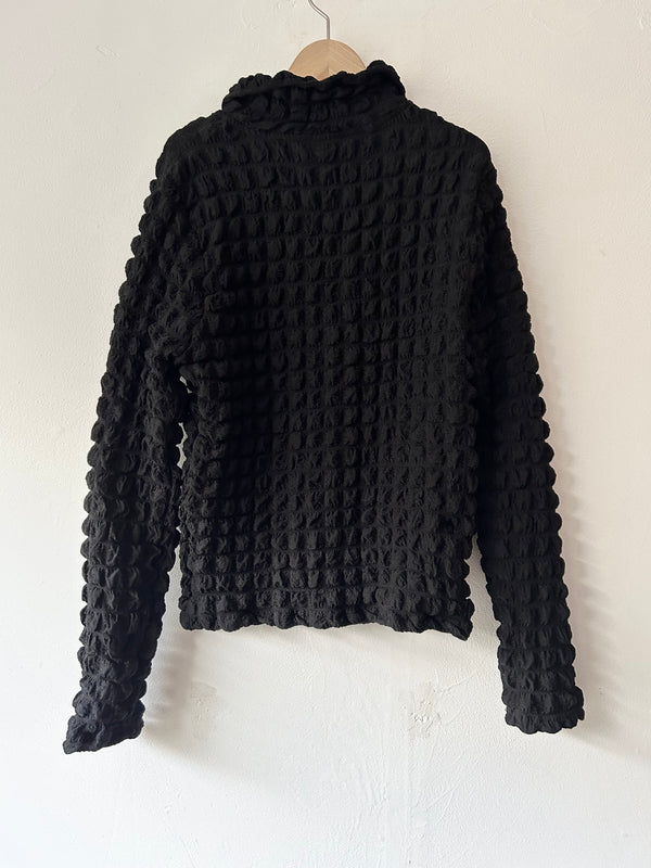 Black pon-pon blouse.