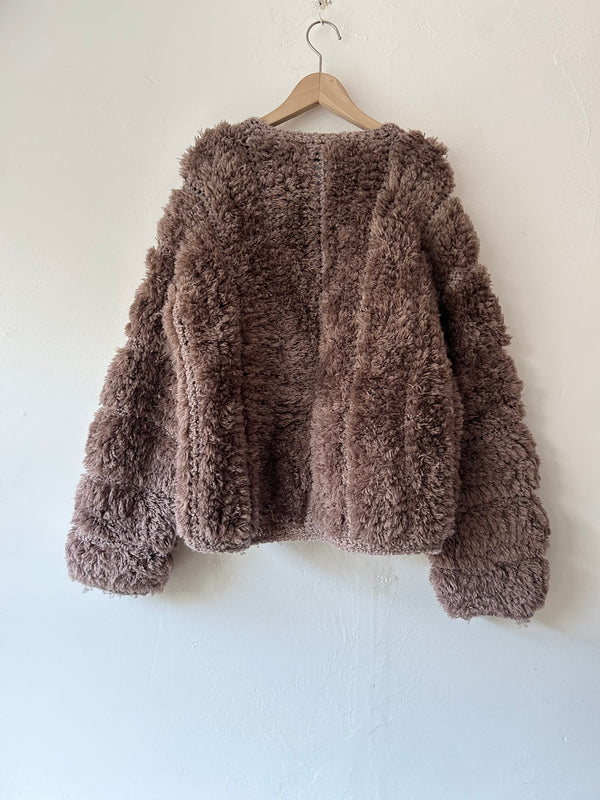 Brown chunky knit cardigan.