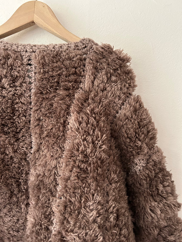 Brown chunky knit cardigan.