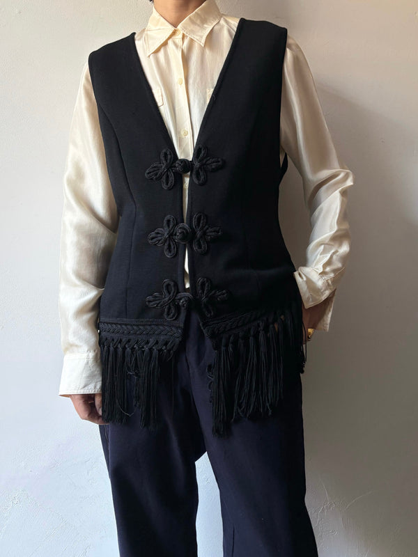 Black fringe knit vest.