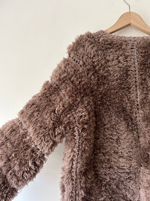 Brown chunky knit cardigan.