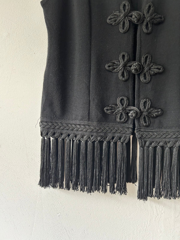 Black fringe knit vest.