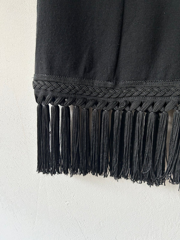 Black fringe knit vest.