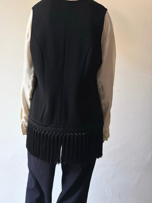 Black fringe knit vest.