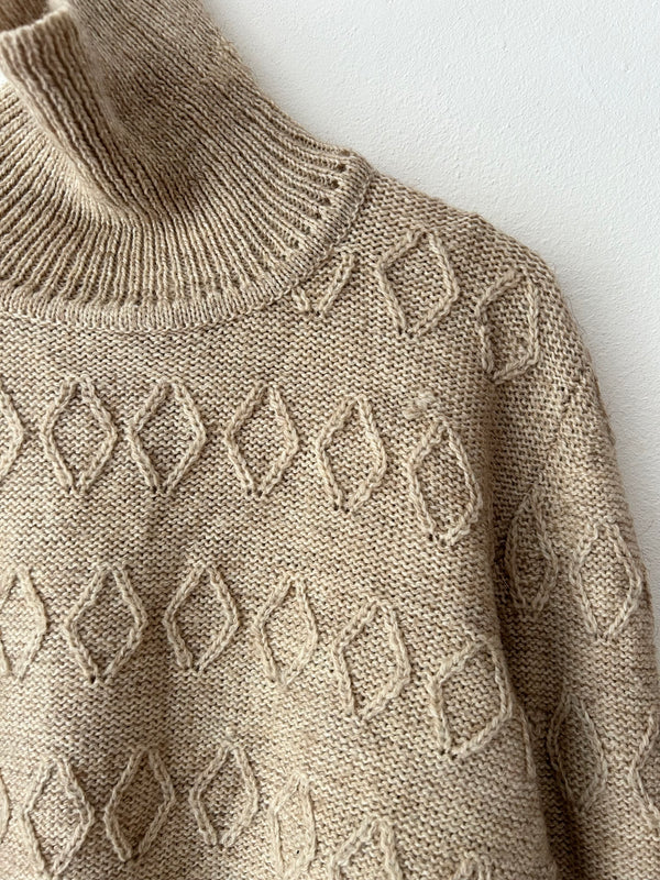 High neck beige knit.