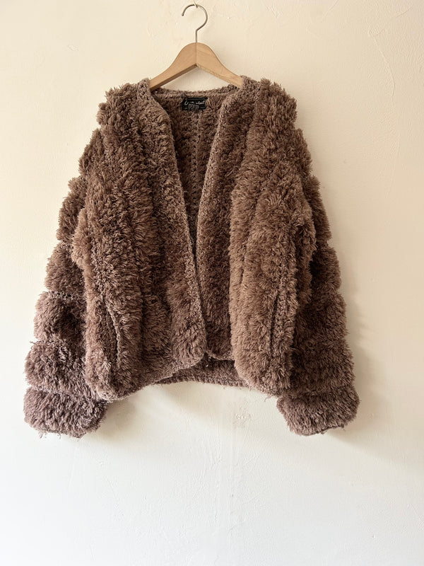 Brown chunky knit cardigan.