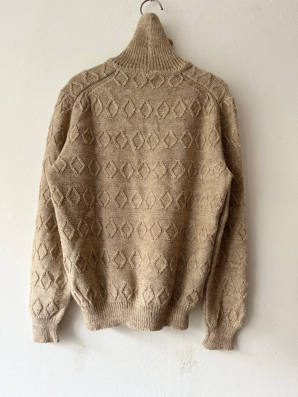 High neck beige knit.