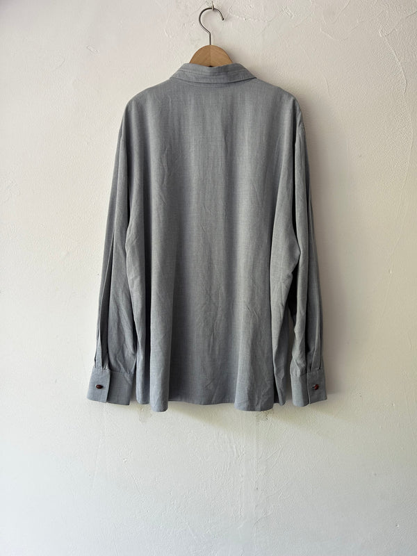Blue longsleeve blouse.