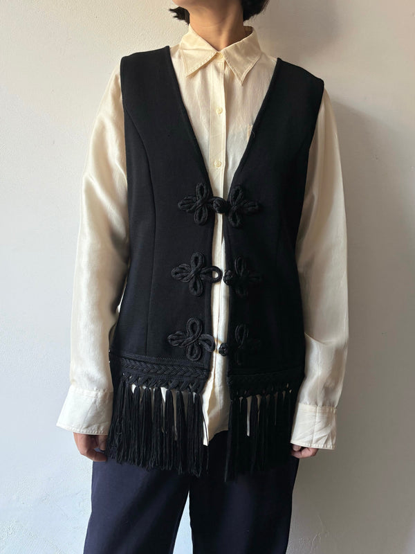 Black fringe knit vest.