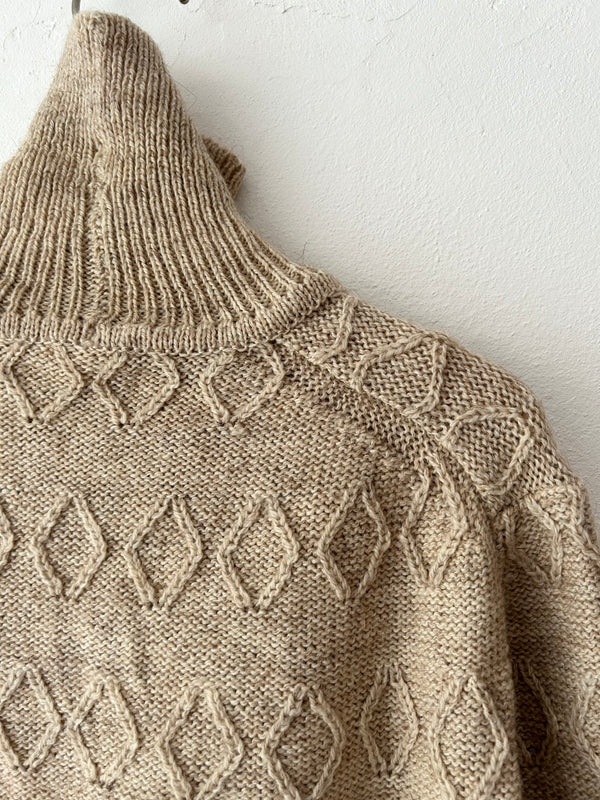 High neck beige knit.