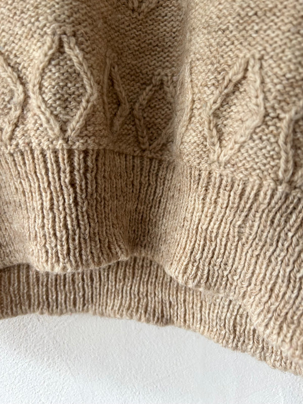 High neck beige knit.