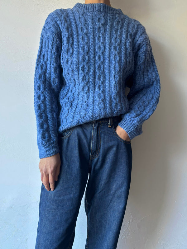 Blue hand cable knit.