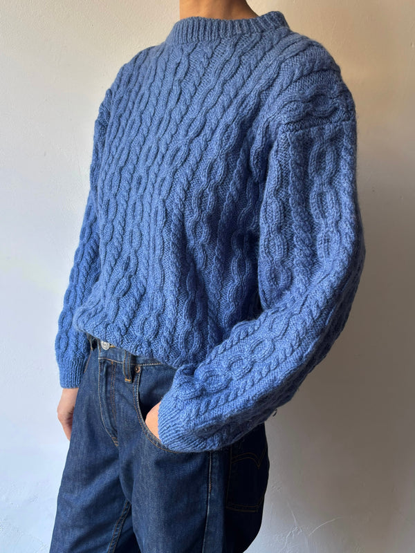 Blue hand cable knit.