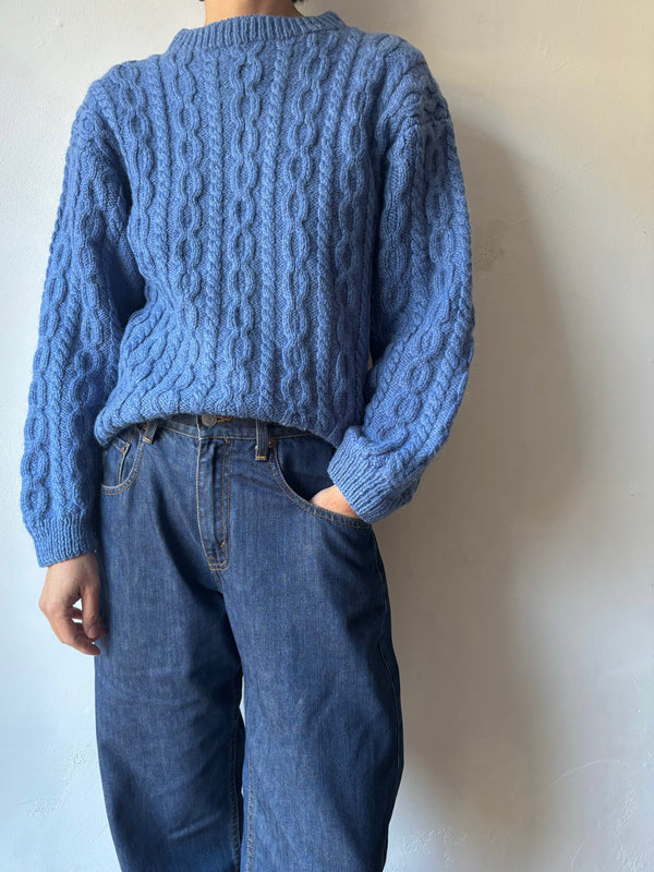 Blue hand cable knit.