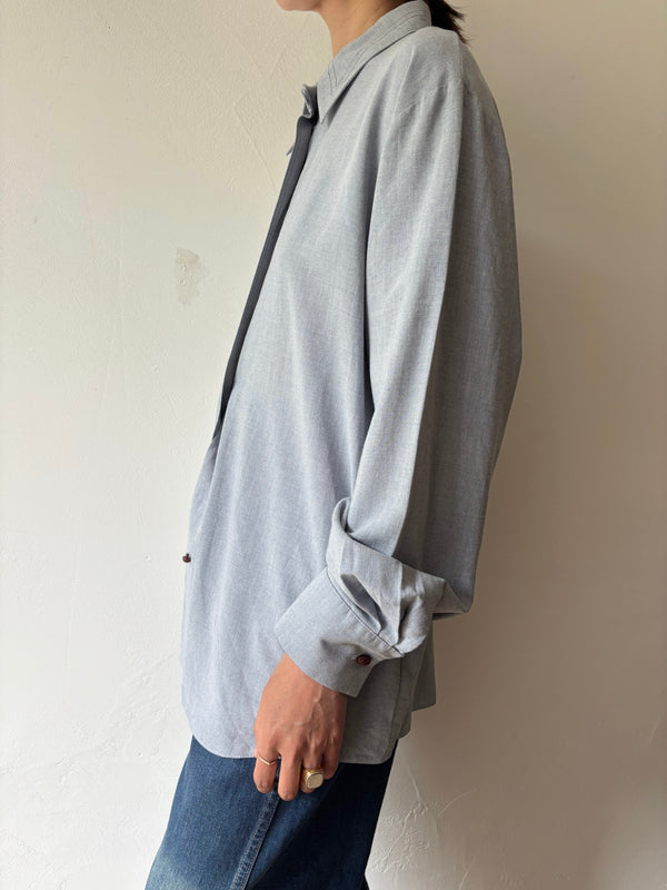 Blue longsleeve blouse.
